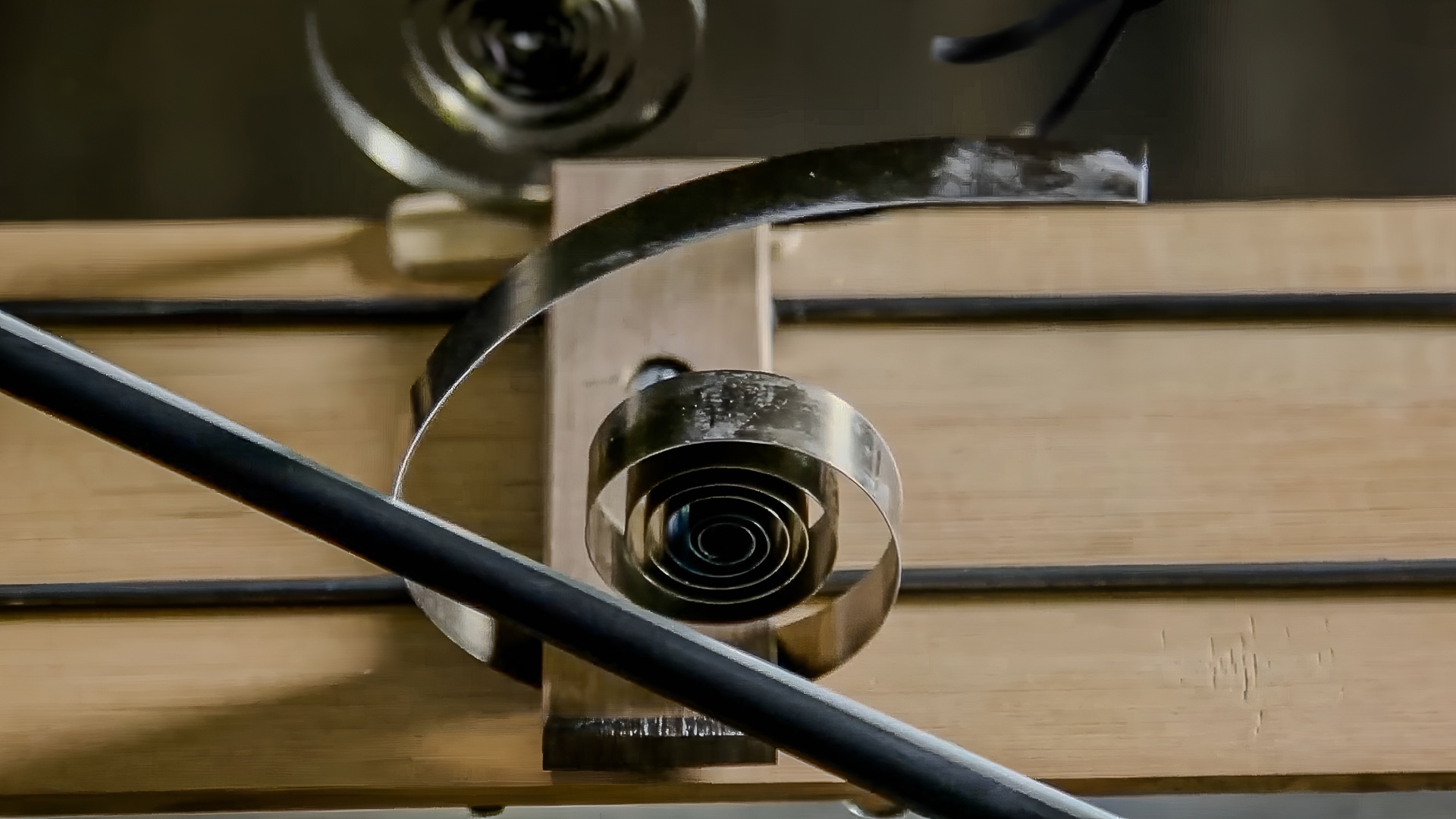 Objects like rulers, springs, and metal parts shape the sound