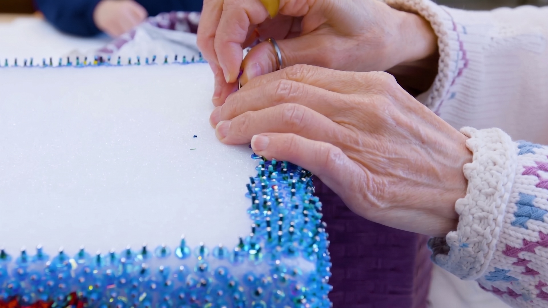 Despite severe visual limitations, her pieces burst with detail and rhythm