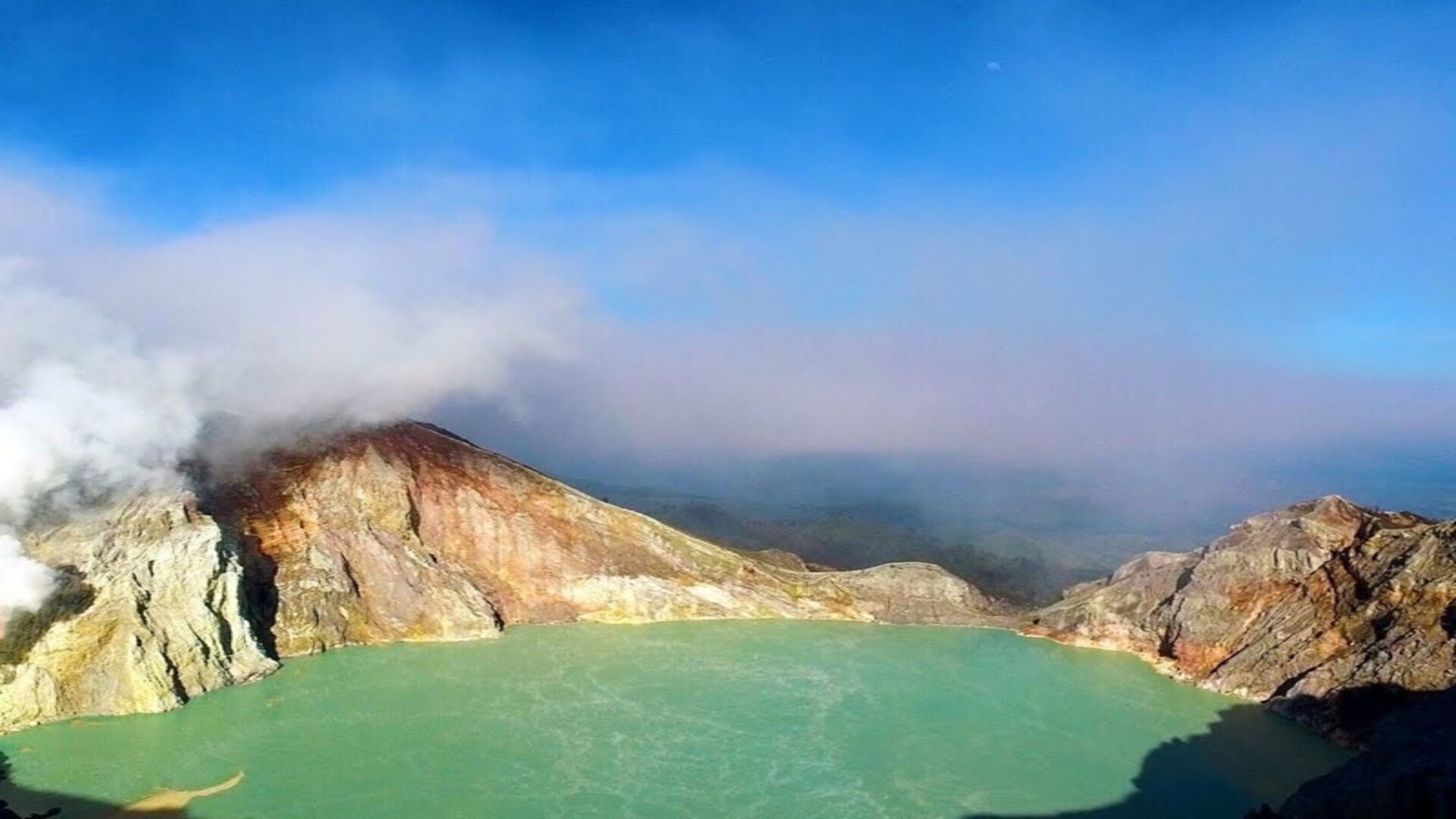 Kawah Ijen volcano, blue flames and dangerous sulphur mining